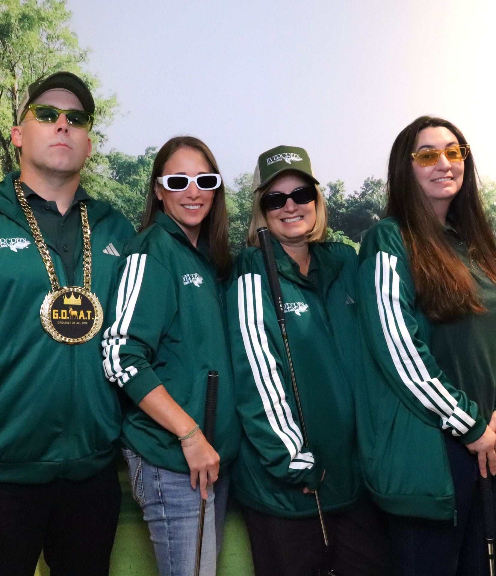 A foursome in matching green jackets at the 2025 Living Room Invitational
